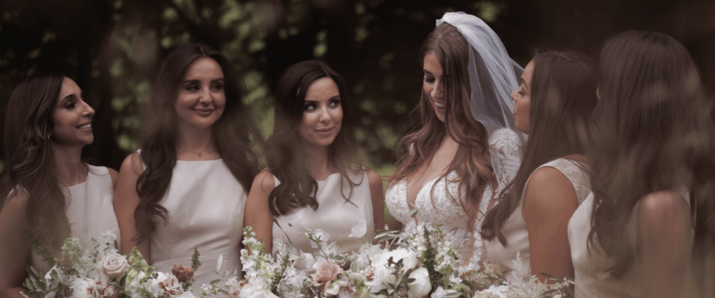 Bride with her bridesmaids on her wedding day
