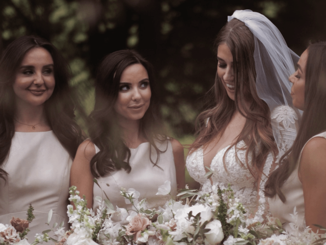 Bride with her bridesmaids on her wedding day